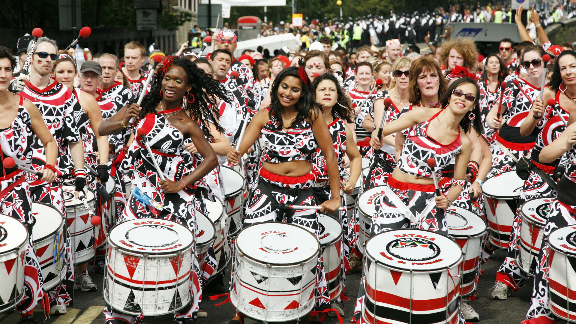 A band of drummers perform during Notting Hill Carnival parade