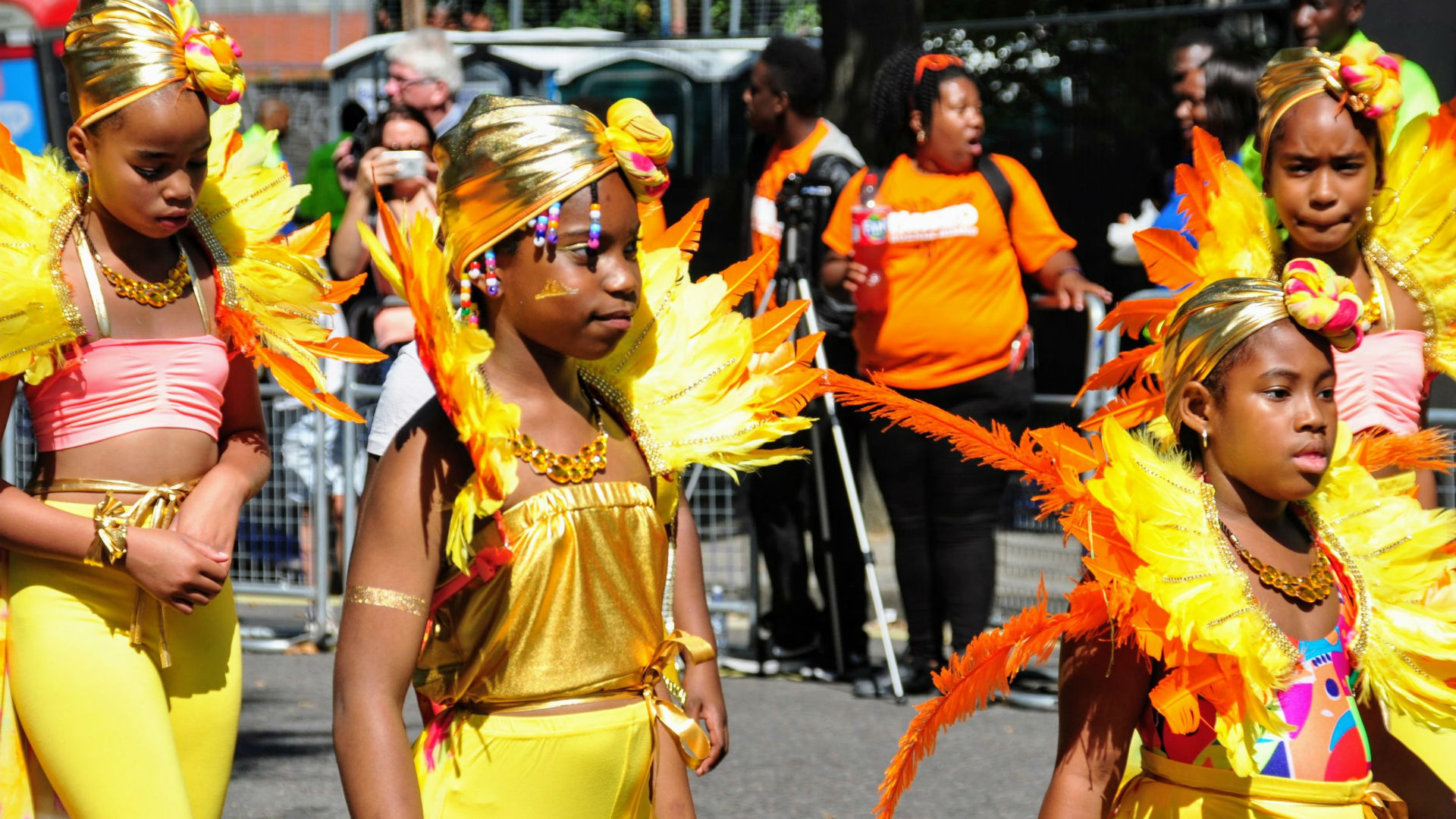 A photo of children dressed in yellow costumes at the Notting Hill Carnival.