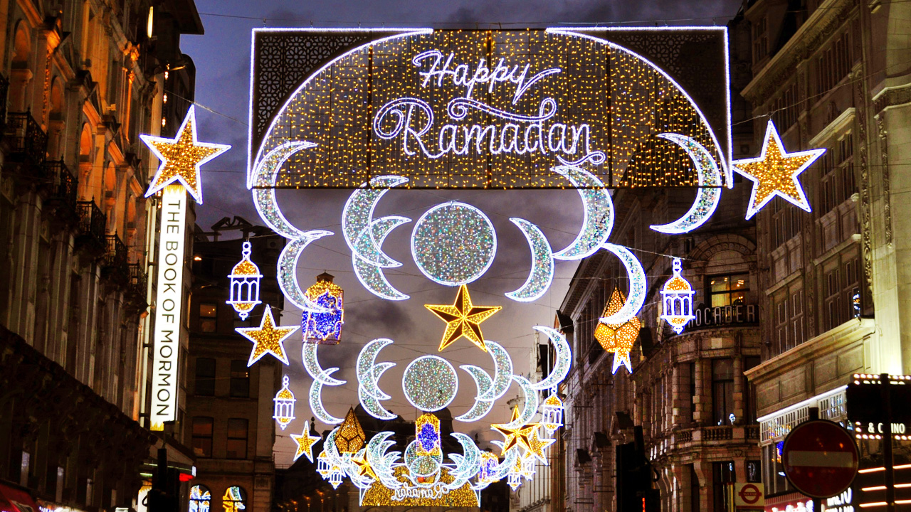 Star and moon lights against a happy ramadan sign in London.