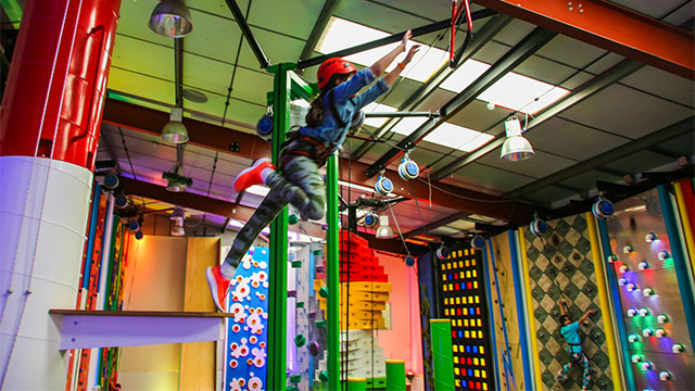 The adrenaline-pumping Leap of Faith at Clip 'n Climb in Chelsea © Clip 'n Climb. Image courtesy of Clip 'n Climb. A child jumping from a platform and reaching for the bar at the Leap of Faith climbing challenge at Clip 'N Climb in Chelsea