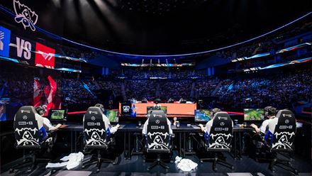 Image showing the League of Legends players compete at the World Championships with a packed crowd in front of them. Image courtesy of Riot Games