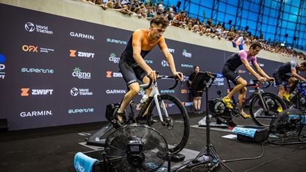 Competitors pedal on stationary bikes. Image courtesy of Supertri