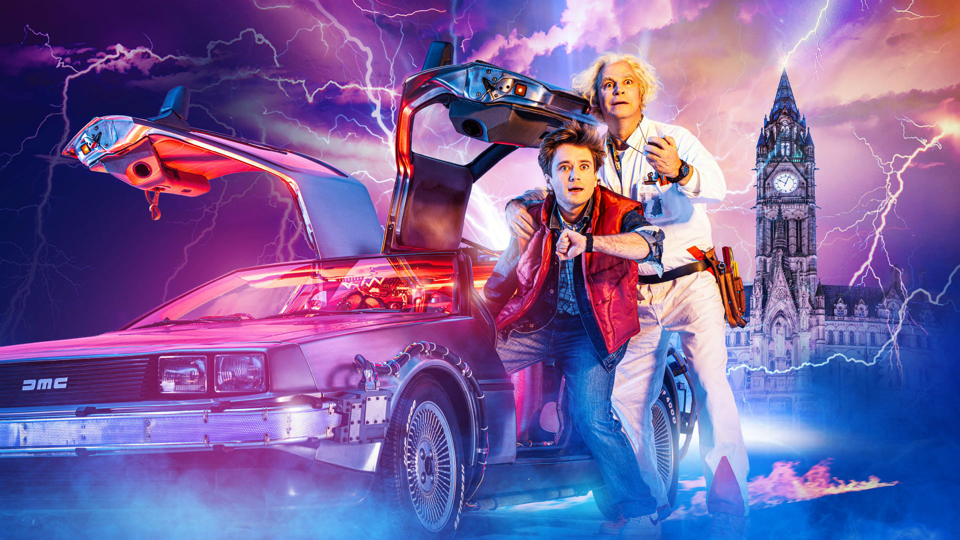 Olly Dobson (Marty McFly) and Roger Bart (Doc Brown). Image courtesy of Amanda Malpass PR. Marty McFly and Doc Brown stand next to their time-travelling DeLorean car as lightning flashes around them.