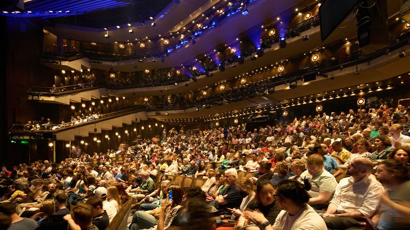 Experience groundbreaking performances at the Barbican. Credit: Dion Barrett. Image courtesy of the Barbican. The Barbican Theatre is filled with audience members awaiting the performance to start.