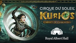 This is the artwork for the Cirque du Soleil show, KURIOS, to be presented at the Royal Albert Hall. It shows a woman dressed in a black-and-white patterned bodysuit emerging from a series of iron circles that resemble an interdimensional portal.