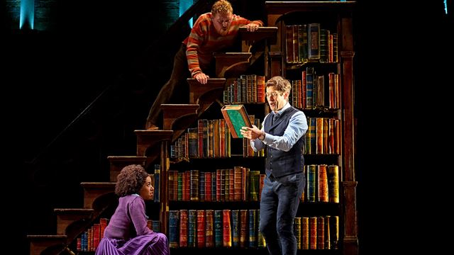 Harry Potter and his two acolytes Ron and Hermione stands by a book shelf trying to solve a mystery.