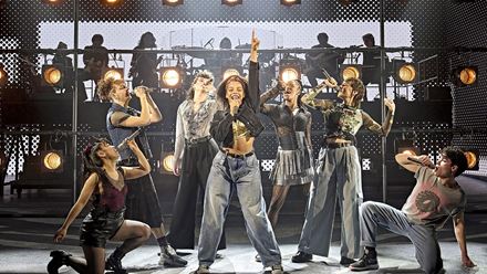 Hear hits from historic bands and singers including Queen and Elton John in the new London musical Just For One Day – The Live Aid Musical. Image courtesy of Dewynters/Photos from the production of 2024 at the Old Vic.