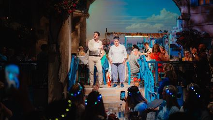The talented cast bring the story of Mamma Mia! The Party to life with live music, comedy and performance. Image courtesy of Golden Tours.