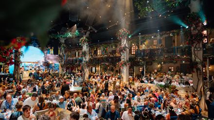 Enjoy dinner and entertainment in the immersive Mediterranean-inspired setting of Mamma Mia! The Party. Image courtesy of Golden Tours.