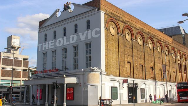 The Old Vic theatre near Waterloo with a white front and beige bricks.