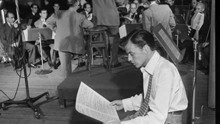 Frank Sinatra in the recording studio, captured mid-session with an orchestra - moments like these inspire the story told in Sinatra The Musical. Image courtesy of Story House PR.