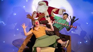 Cast of stick man dressed in Christmas outfits with props, including Santa Claus figure.