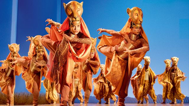The Lion King musical © Deen van Meer / See Tickets. Image courtesy of Deen van Meer / See Tickets. Dancers performing the lioness hunt on stage at the Lion King musical