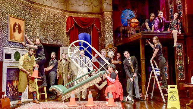 The cast of The Play That Goes Wrong look a bit dishevelled as they cling to their props.