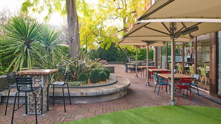 Enjoy afternoon tea or a pre-dinner cocktail at the Urban Meadow Terrace. Image courtesy of Hilton.