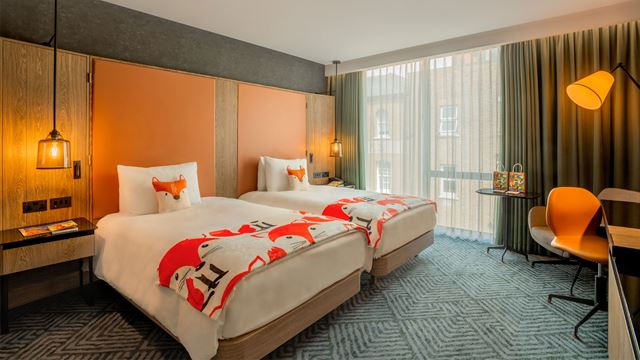 Twin beds as part of a family room with fox details at Hilton London Bankside.