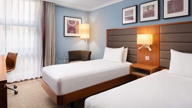 Twin beds in bedroom at Hilton London Kensington.