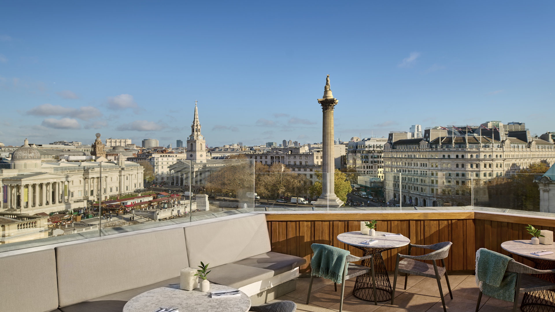 roof terrace with tables and chairs overlooking trafalgar square 