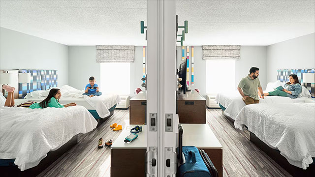 A family in confirmed connecting rooms at Hilton