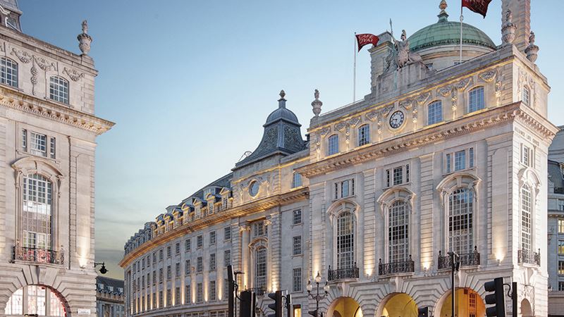Step inside this gorgeous five-star hotel for a truly memorable stay. Credit: Hotel Café Royal. Image courtesy of Hotel Café Royal. Hotel Café Royal's iconic curved facade on Regent Street on a clear evening.