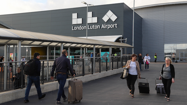 Passengers walking out of London Luton Airport. Image courtesy of Shutterstock.