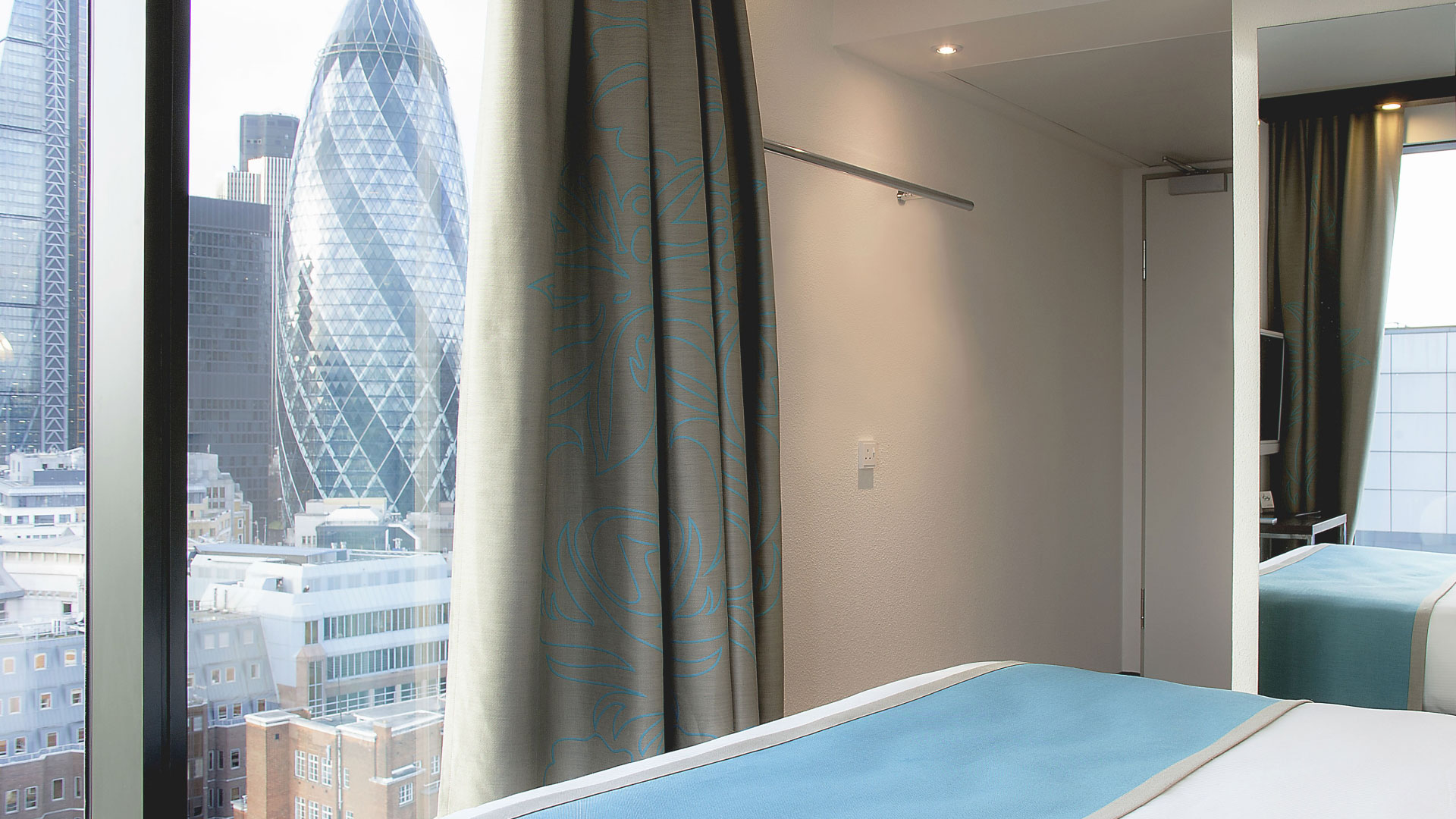 A view of the Gherkin and other high rise buildings from a modern hotel room