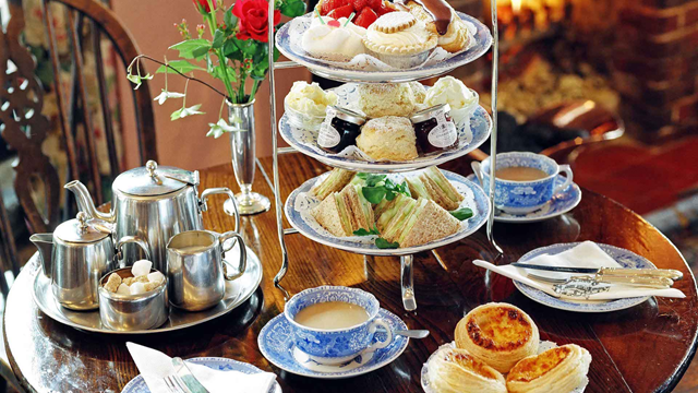 Afternoon tea spread with sandwiches, scones, cakes and Maids of Honour tarts at The Original Maids of Honour in Richmond.