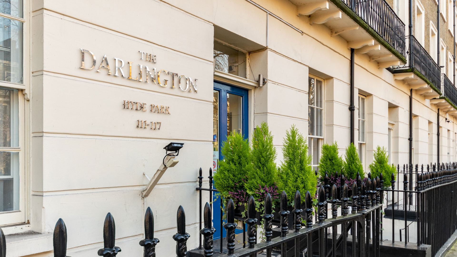 Gold letters spell out The Darlington Hyde Park on the front of an old Victorian townhouse