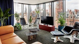 The quirky interiors of a room at The Standard, London with views of the St Pancras International Railway Station.